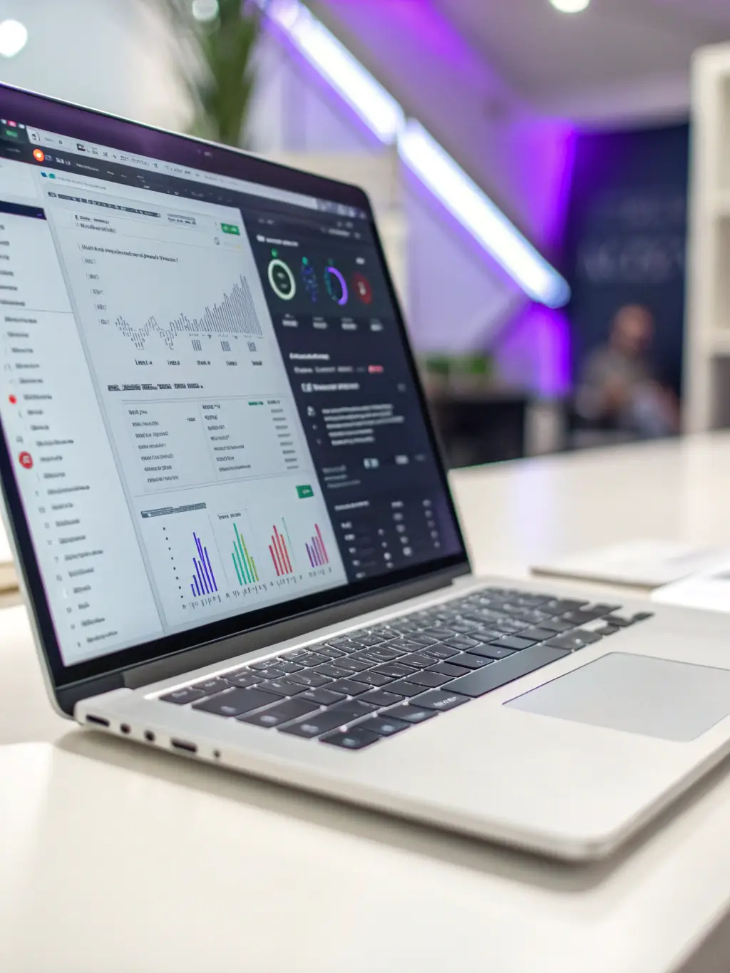 A close-up shot of a laptop displaying a coding interface, with a hand hovering over the keyboard, symbolizing a workshop on digital transformation. This image will be used to promote the digital transformation workshop.